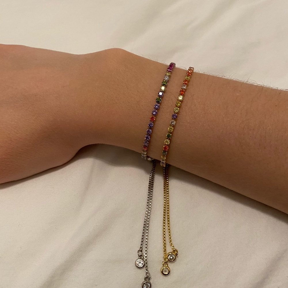 Rainbow rhinestone bracelets.